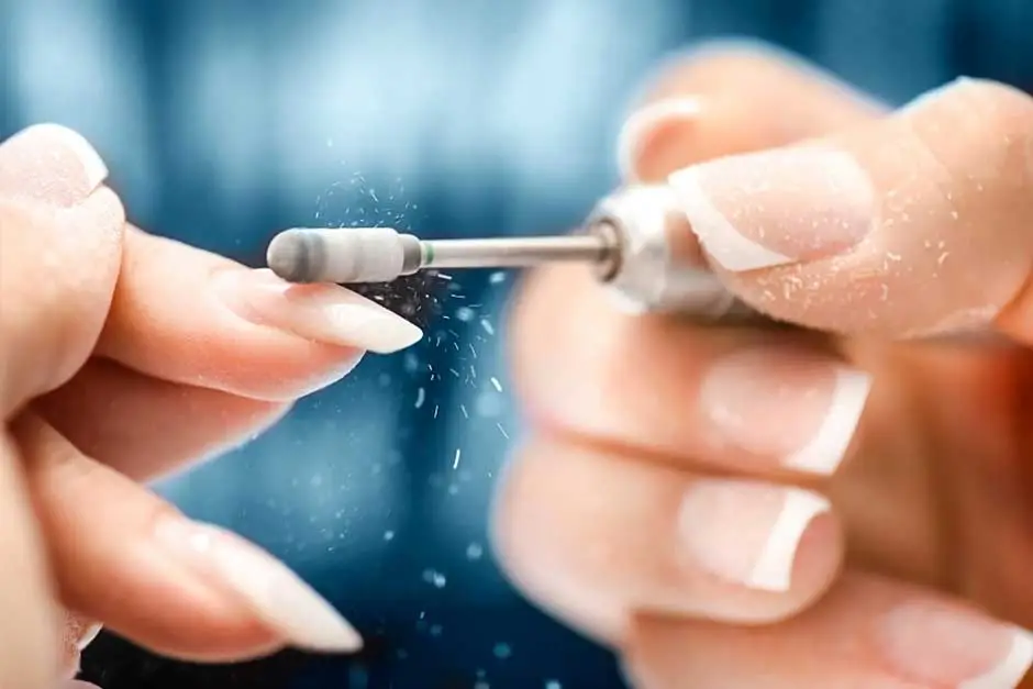 Busy nail salon with technicians providing manicure services to clients Busy nail salon with technicians providing manicure services to clients
